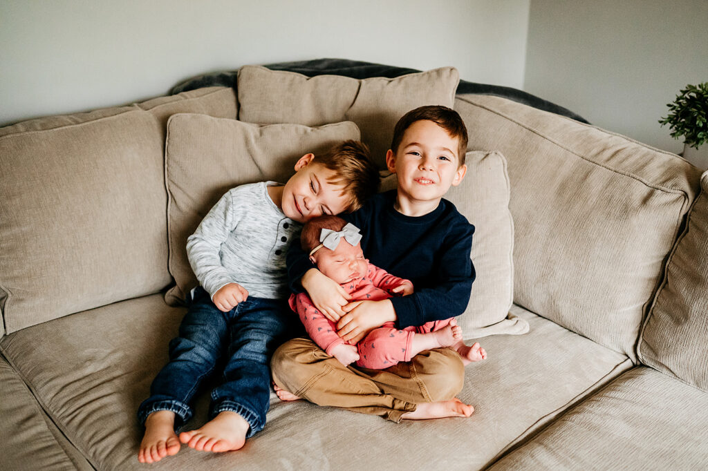 Living rooms with comfy couches make for the perfect spot for sibling photos